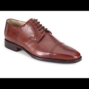 Perforated cap toe lace up shoes